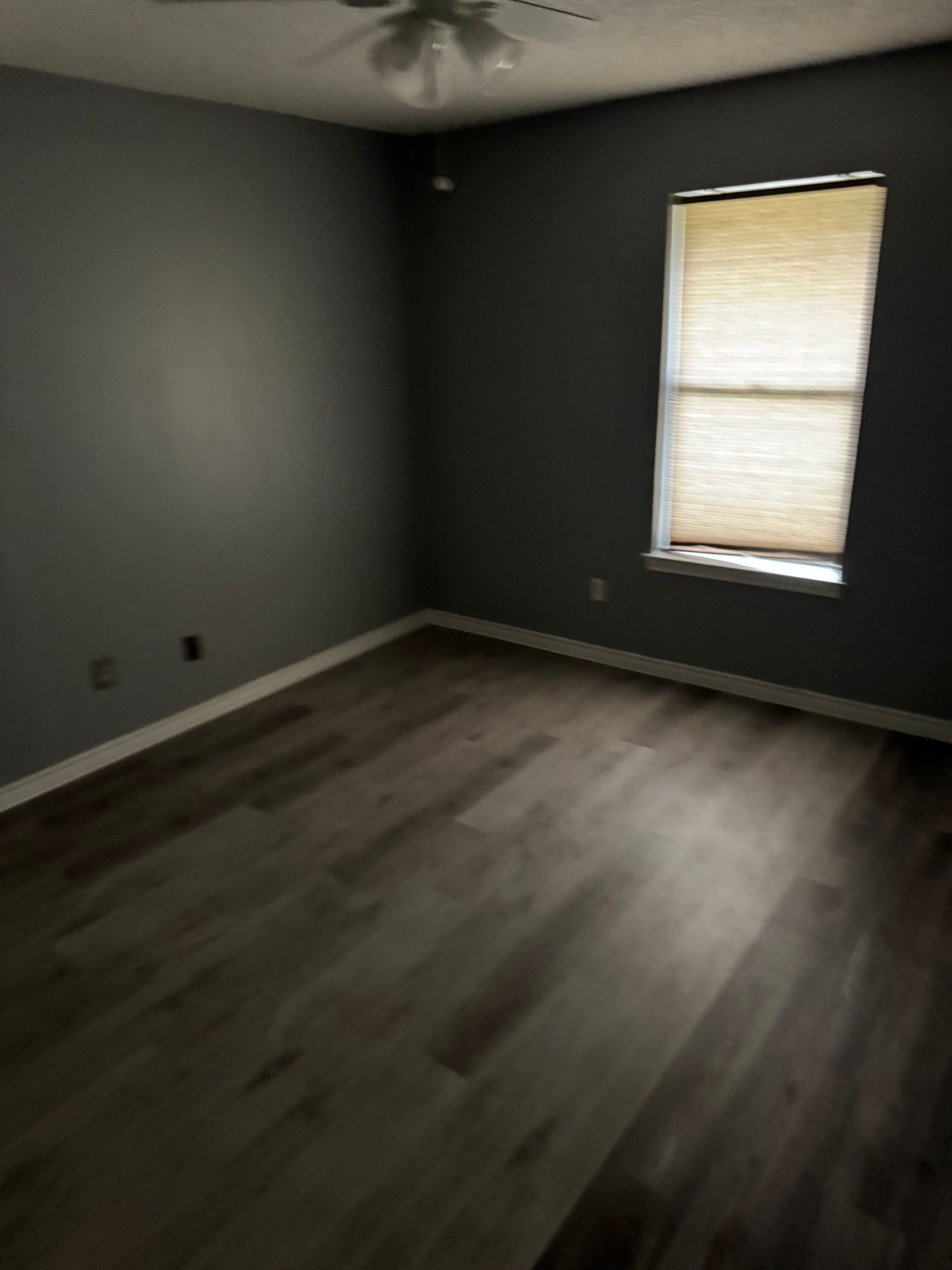 Bedroom with wood-look flooring